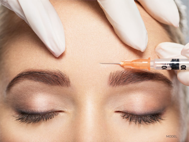 Woman getting cosmetic injection