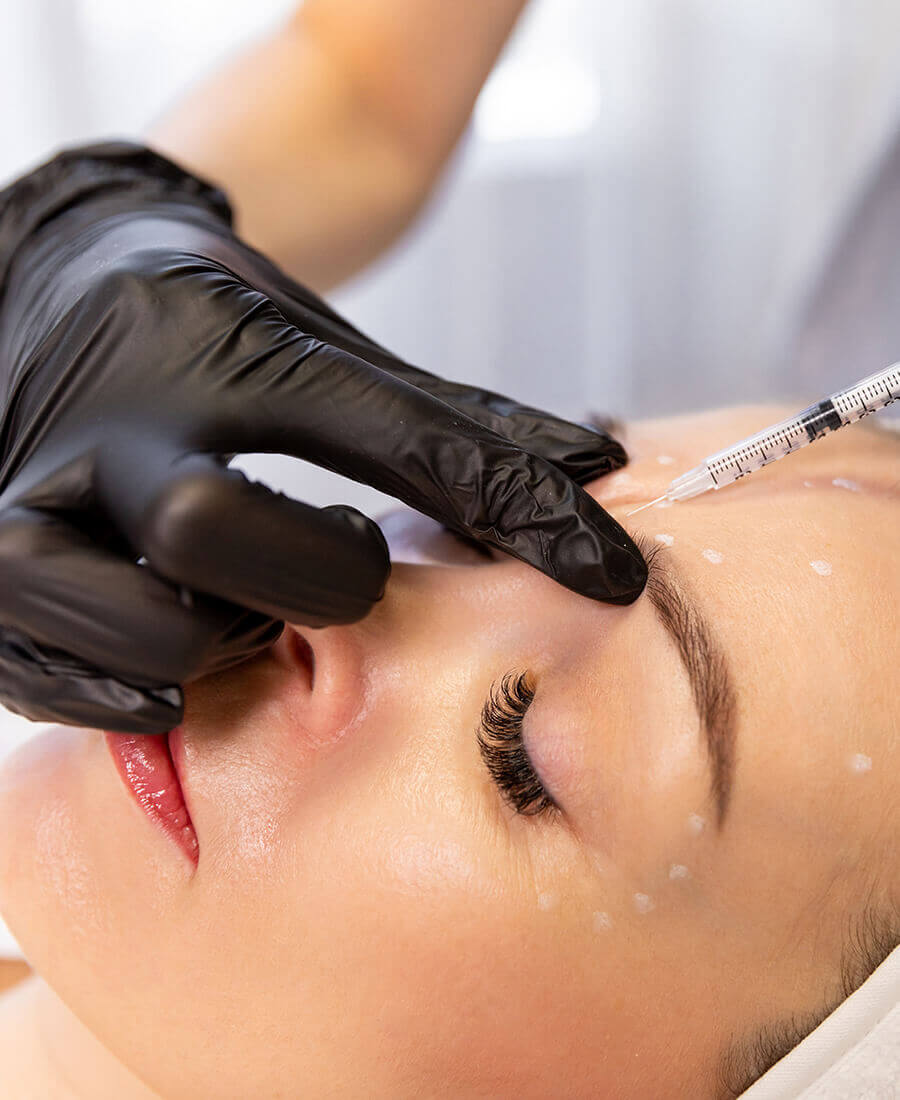 Woman getting a facial injection