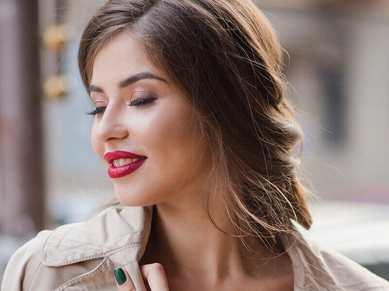 Woman in a tan trench coat