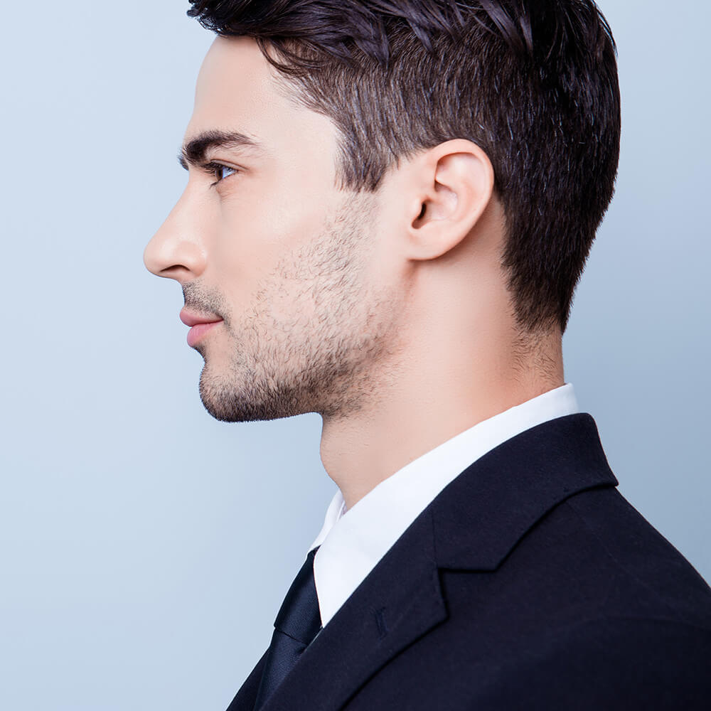 Profile of a handsome man in a suit
