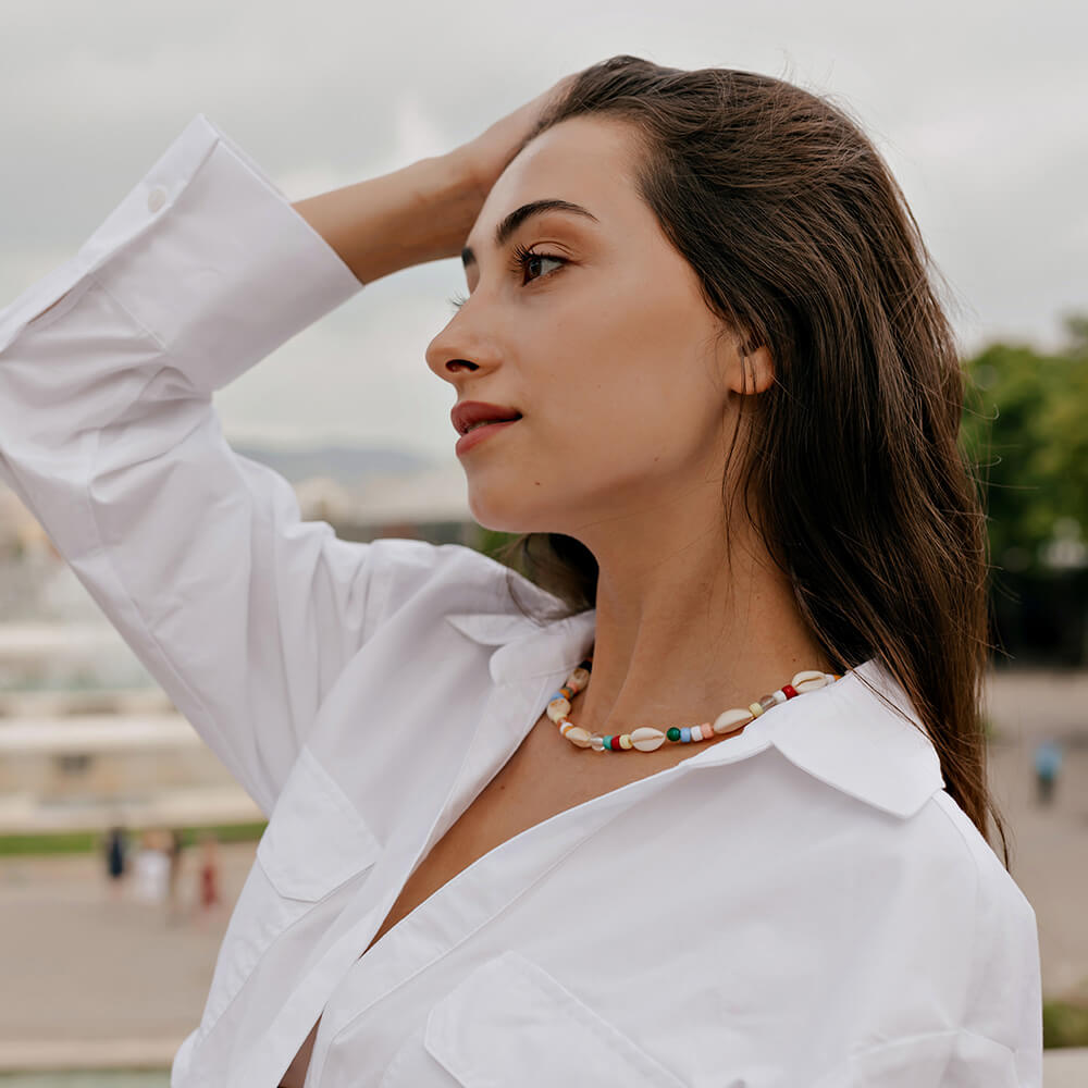 Mature woman with her arm raised
