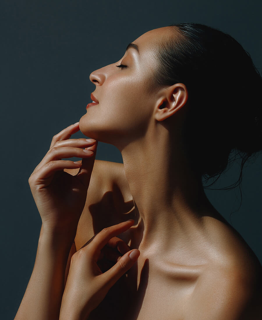 Woman with nice skin touching her chin