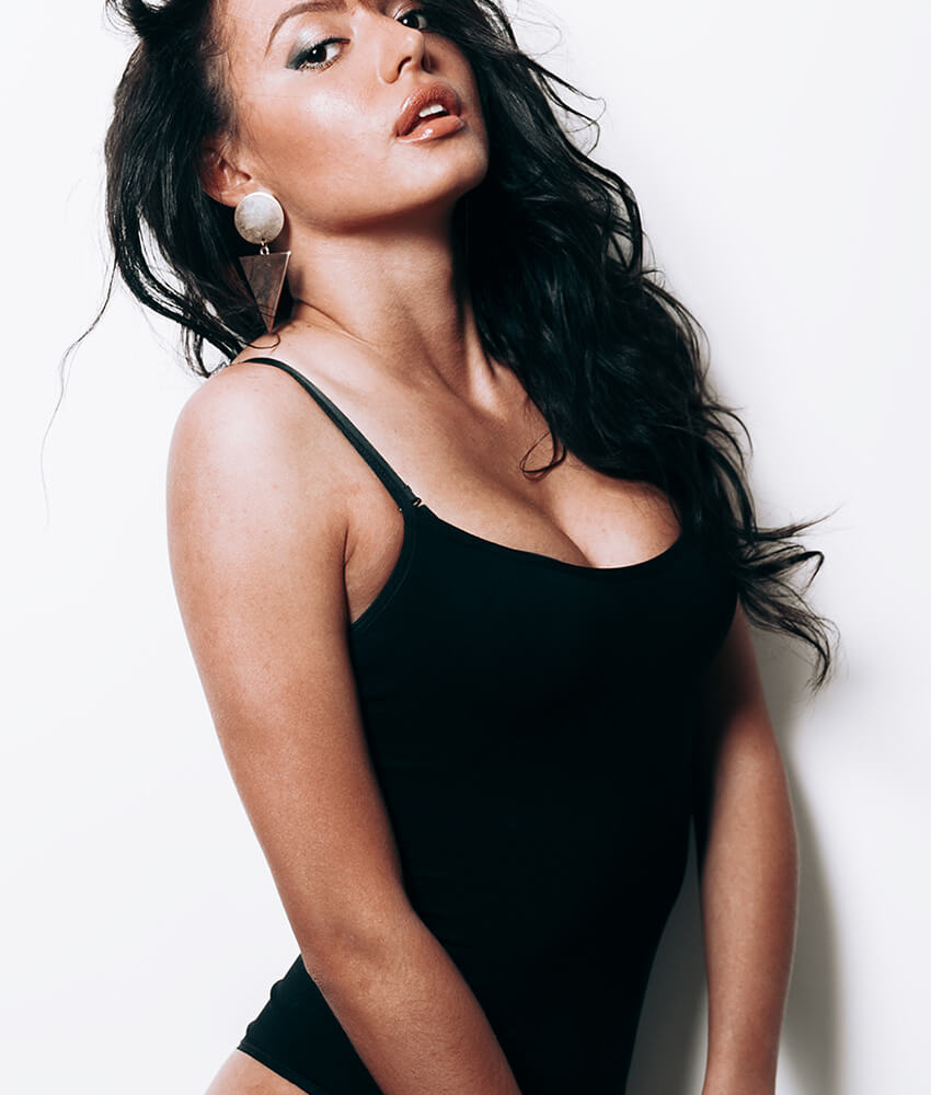 Woman in black wearing earrings