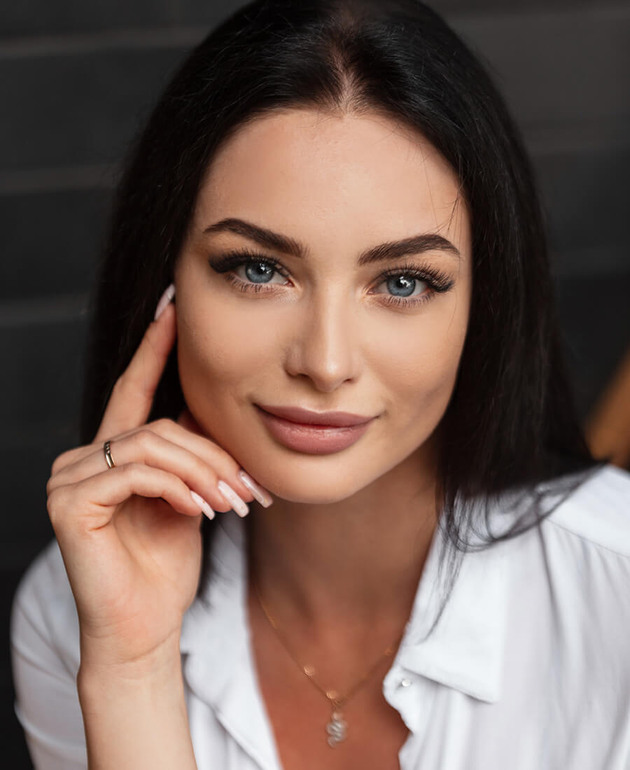Woman with dark hair smiling