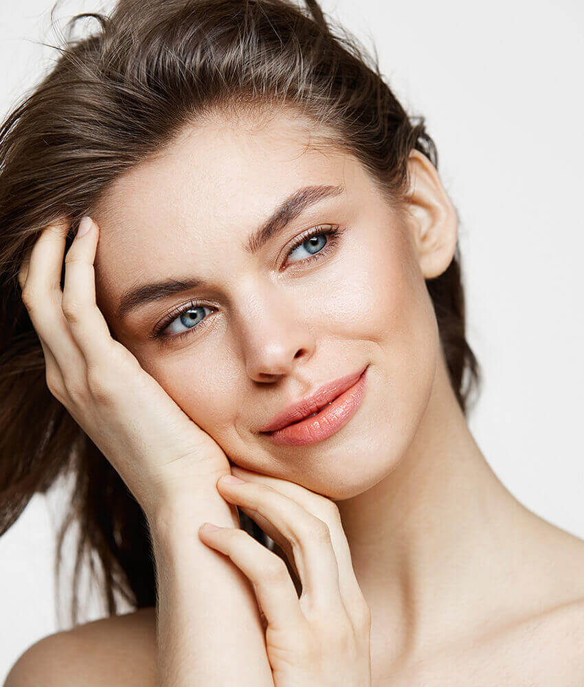 Woman touching her face