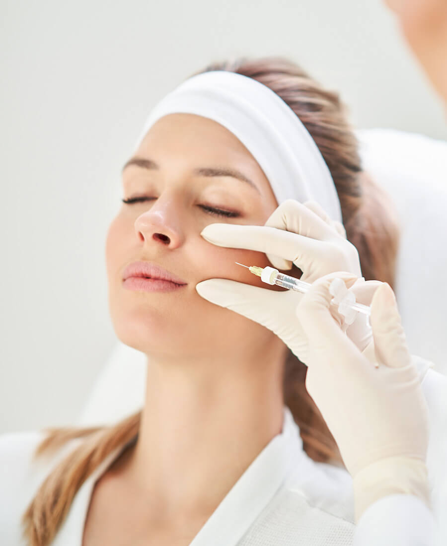 Woman getting a facial injection