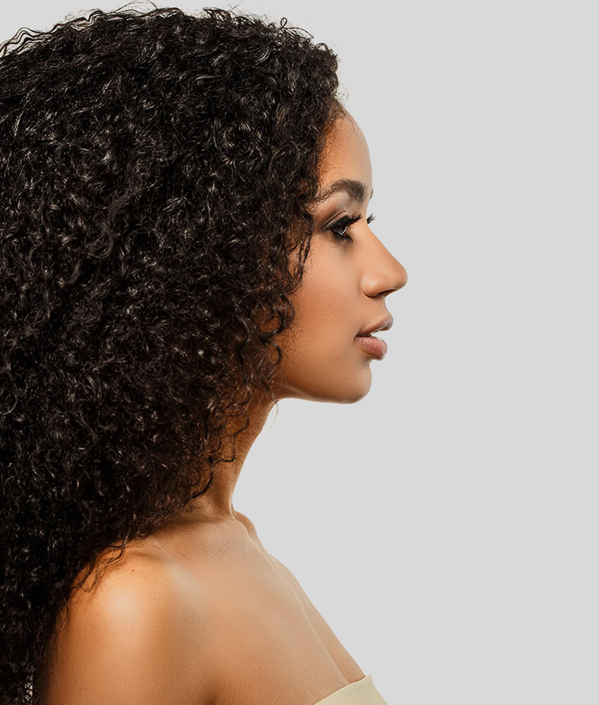 Profile of a young woman with curly hair