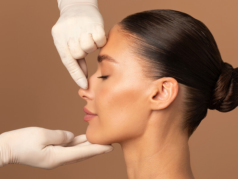 Woman having her nose inspected