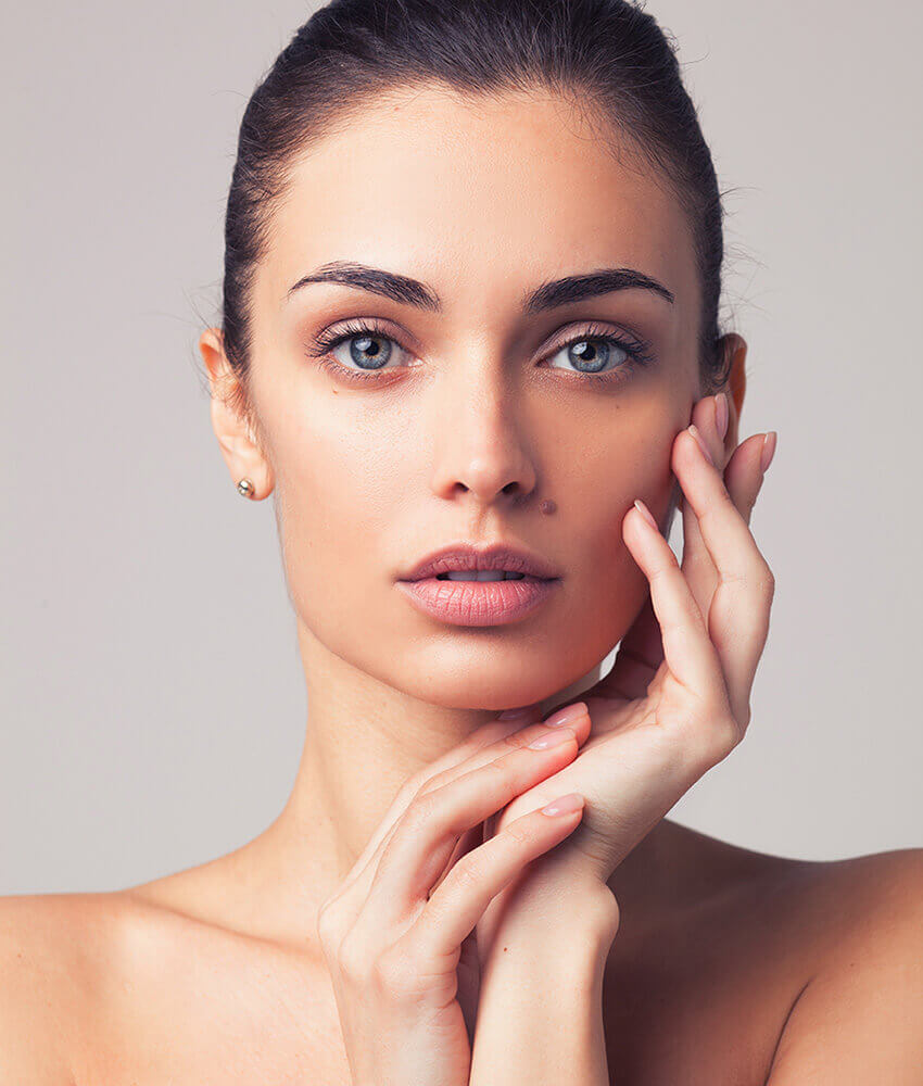 Young woman with a beauty mark