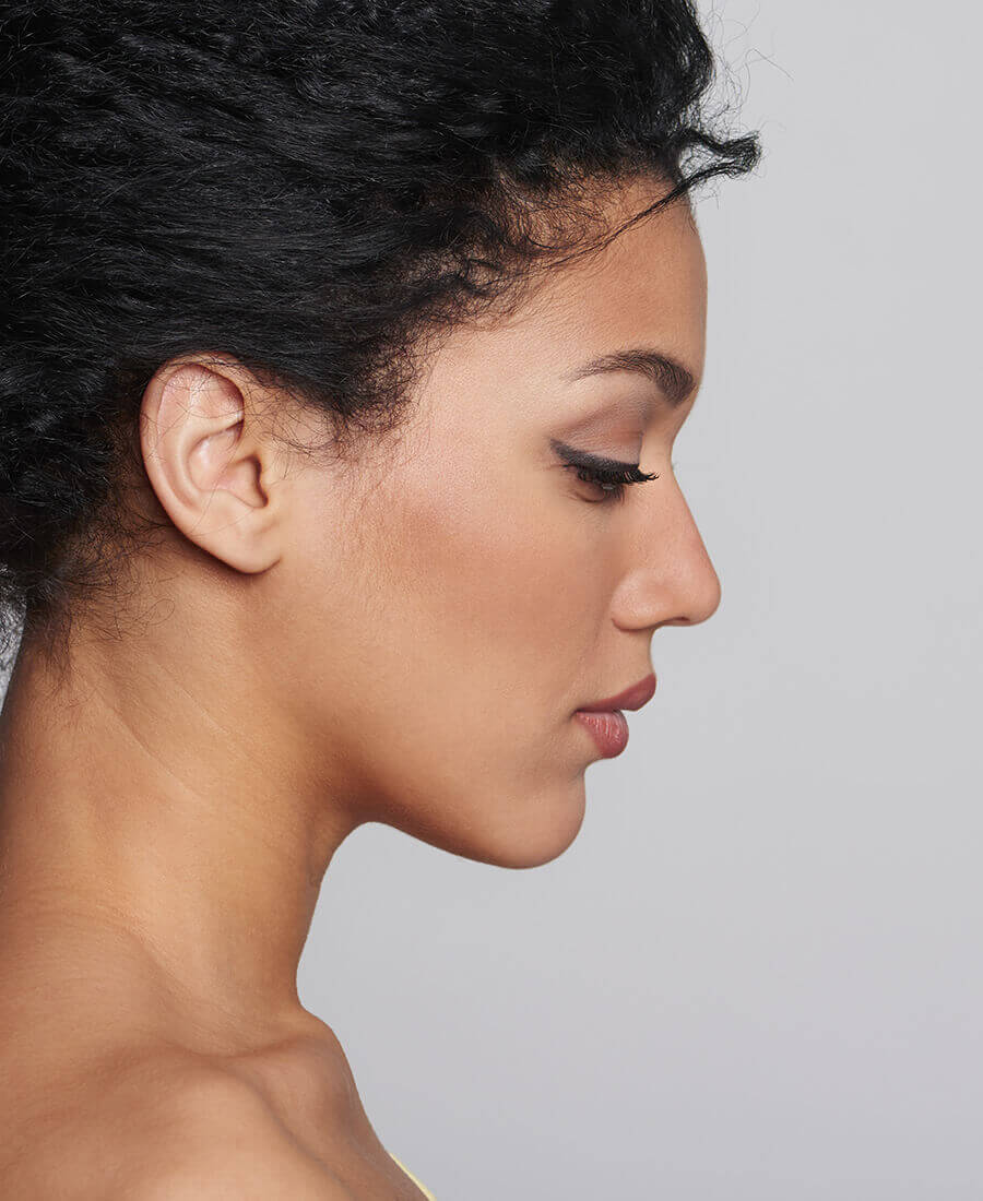 Profile of a young woman with curly hair