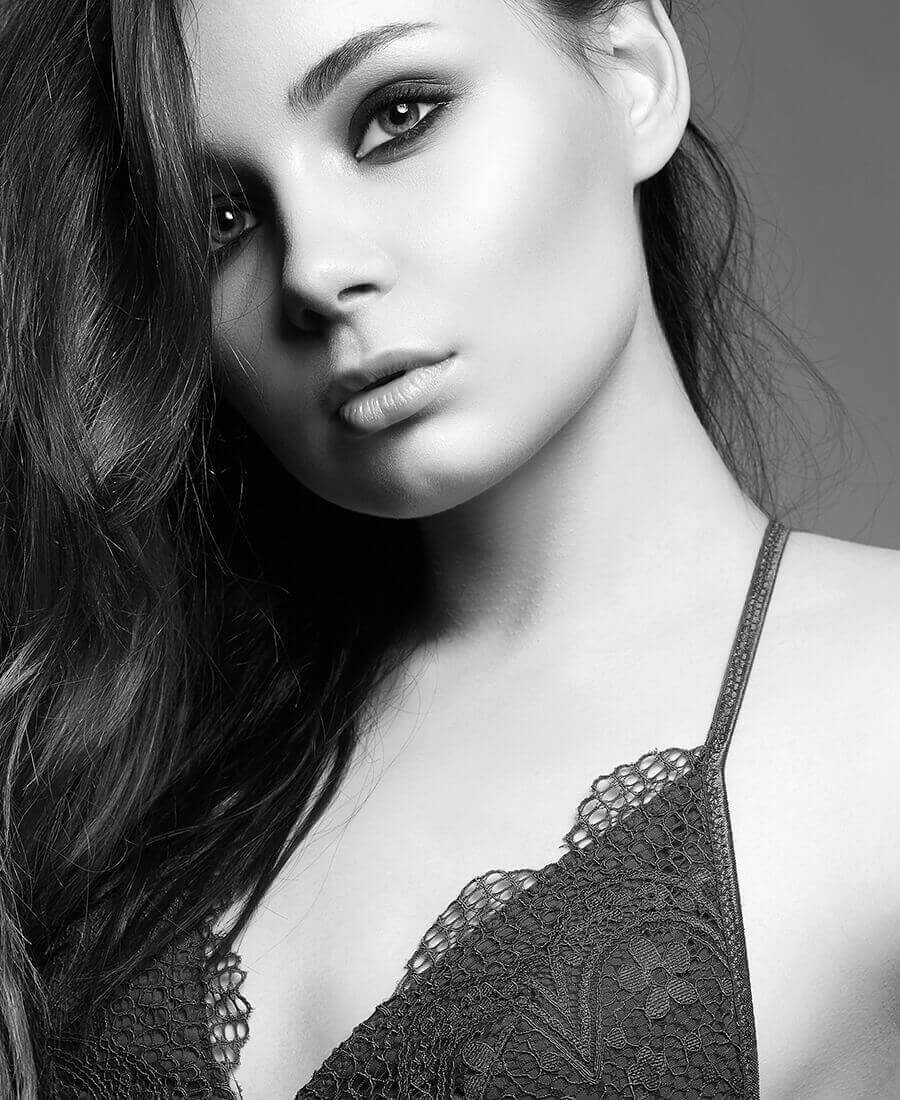 Young woman in a black bra