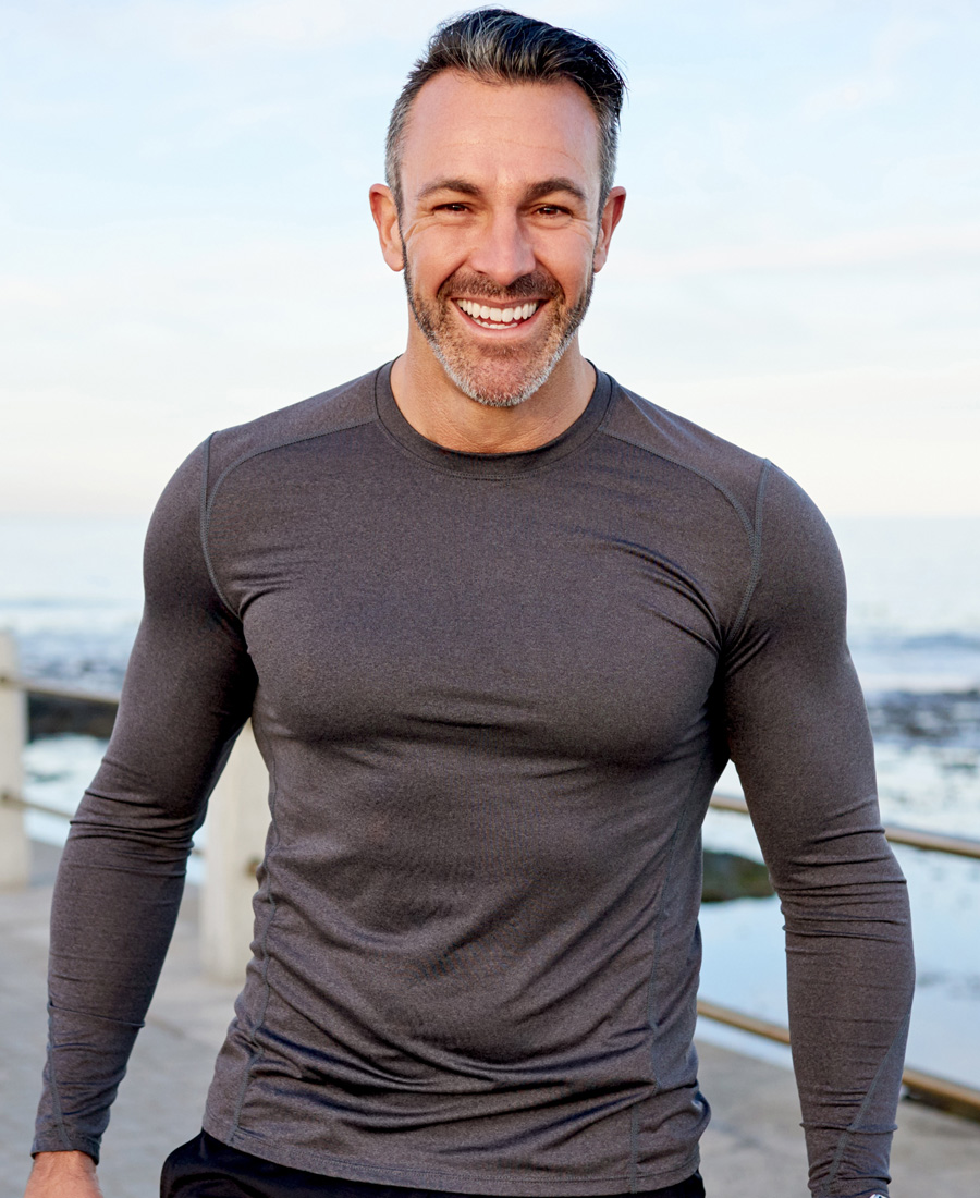 Fit man in a long sleeve black shirt