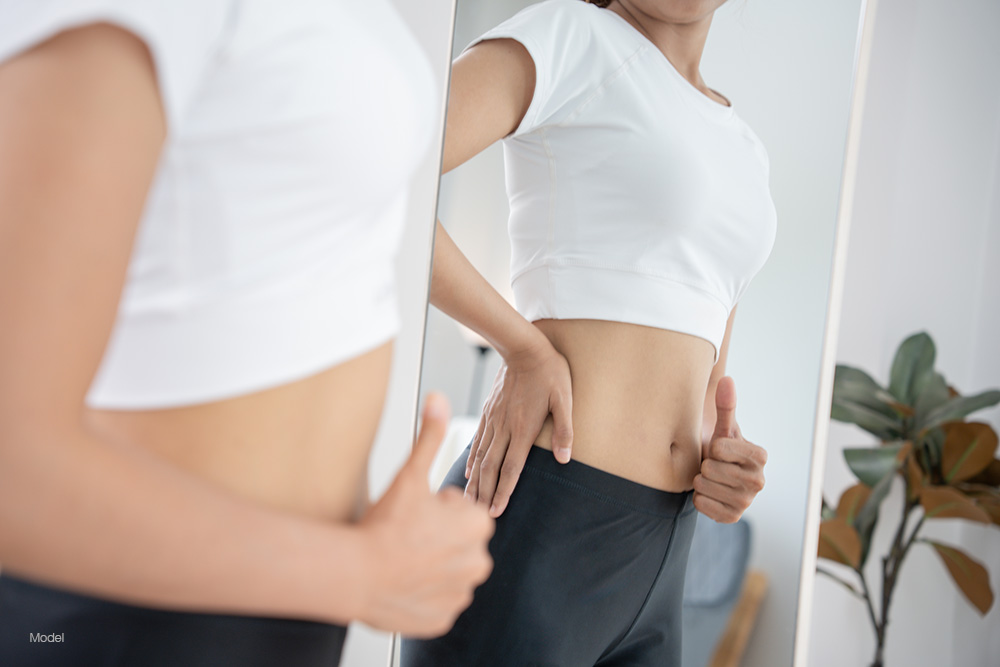 Woman looking at herself in the mirror